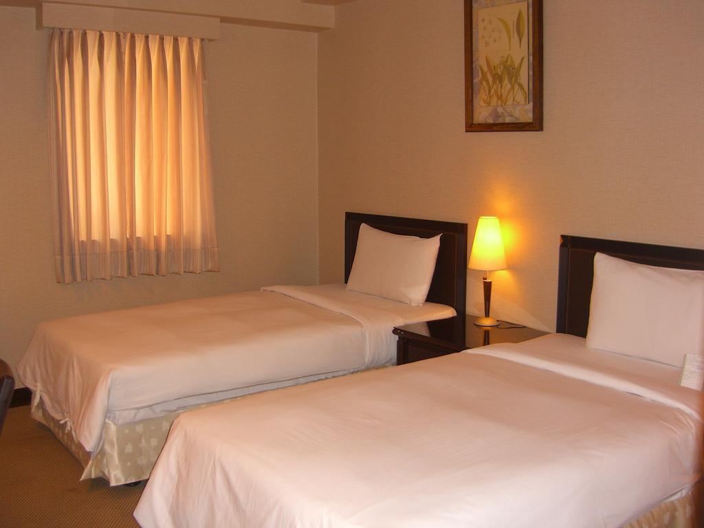 Lincoln Hotel Tainan Quarto foto